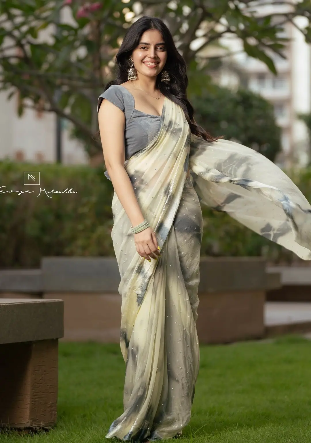 Navya Marouthu Wearing White Saree Sleeveless Black Blouse